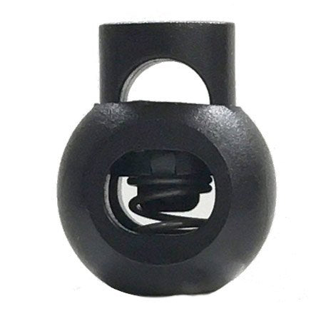 Black rubber toggle with a spring inside on a white background