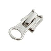 Metallic zipper pull on a white background
