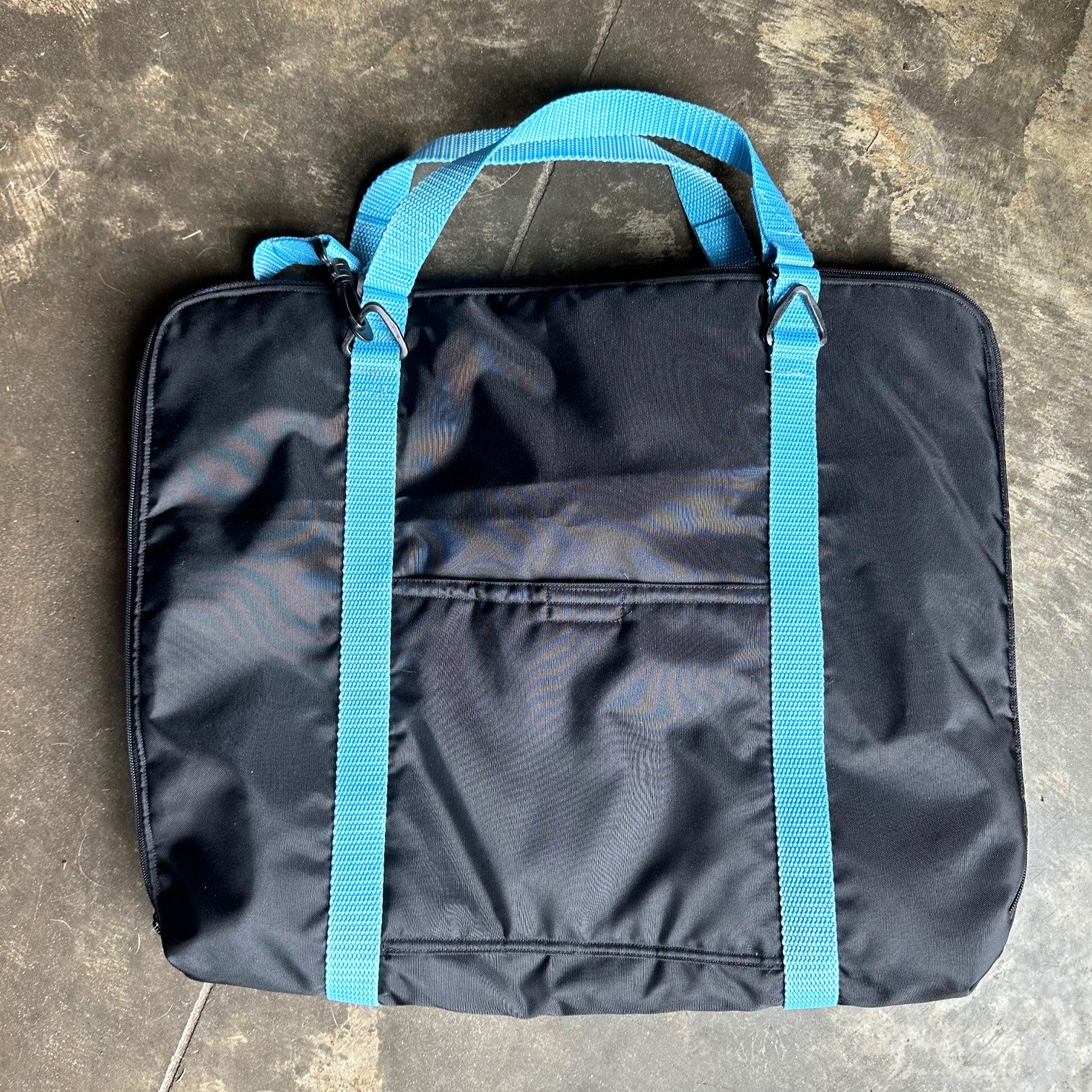 Black briefcase made with blue straps