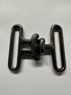 Metallic surcingle on a light gray background