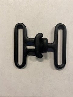 Black metal surcingle on a light gray background