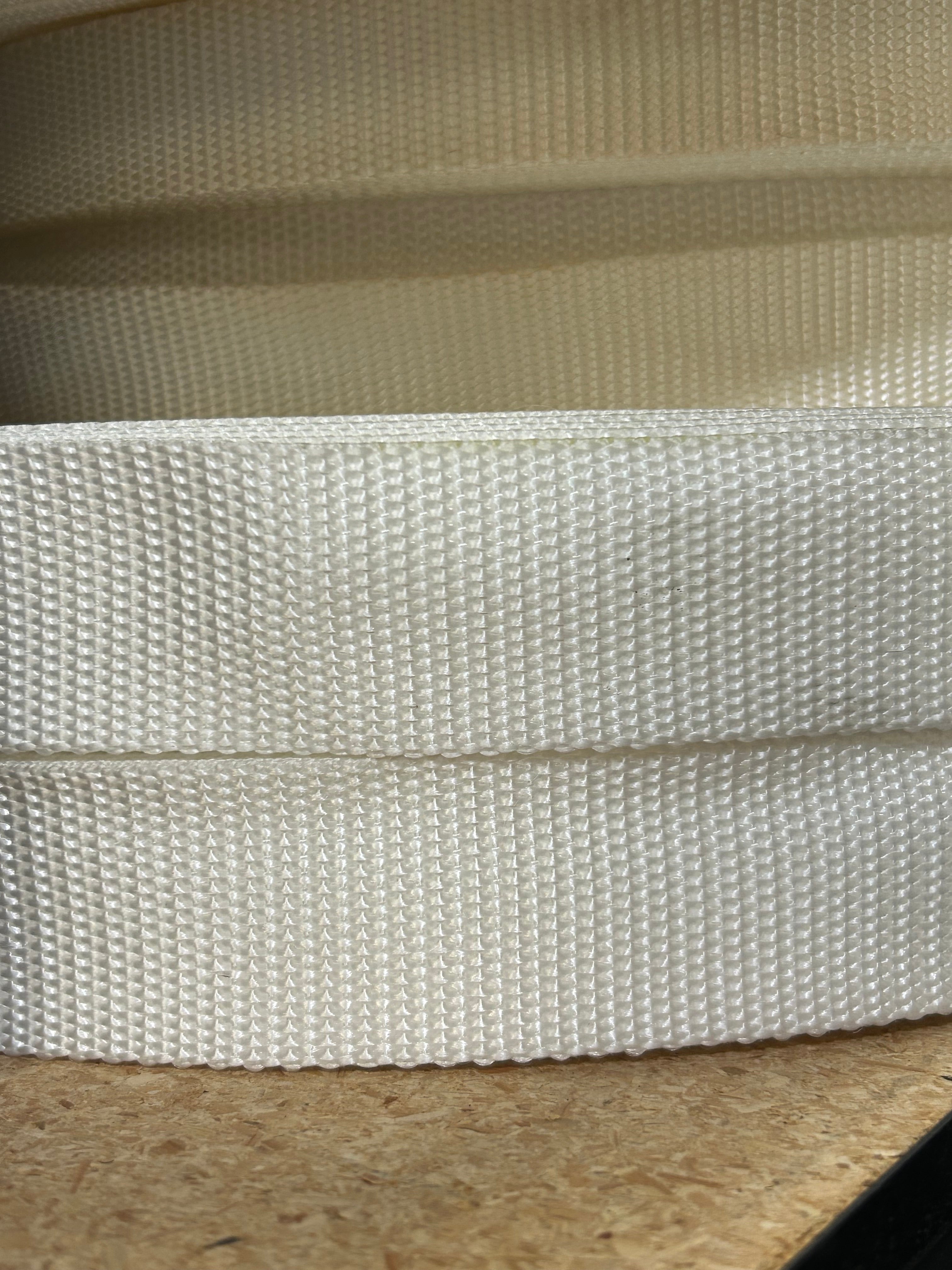 rolls of stacked white webbing