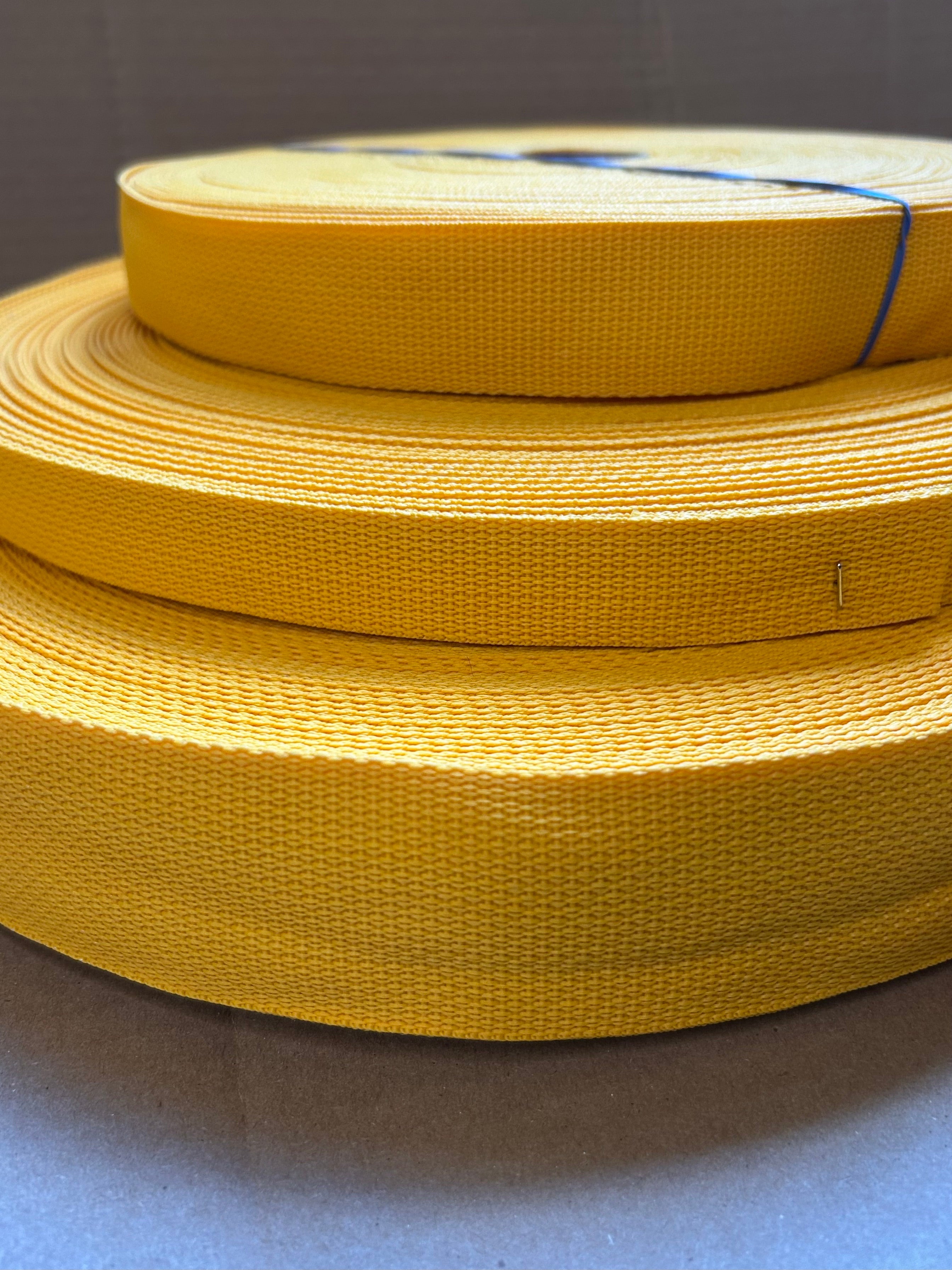 rolls of stacked yellow webbing