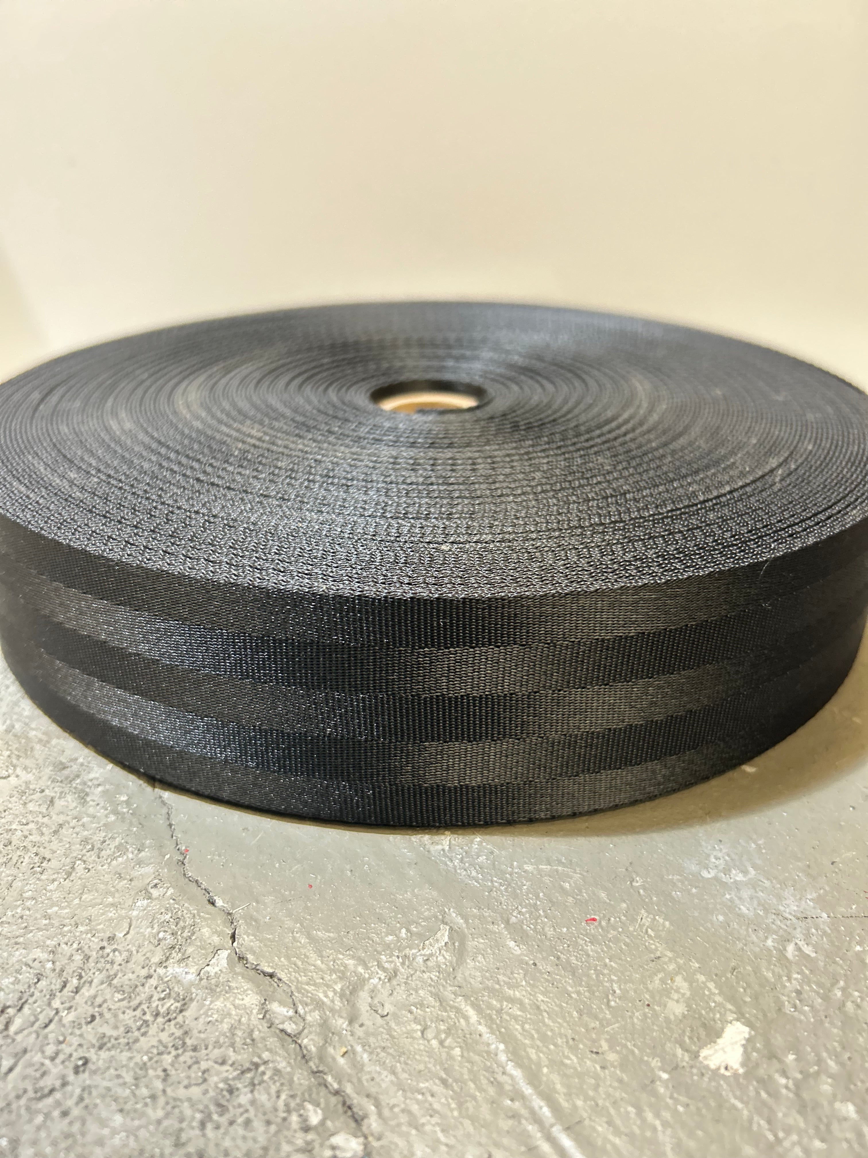 roll of black seatbelt webbing