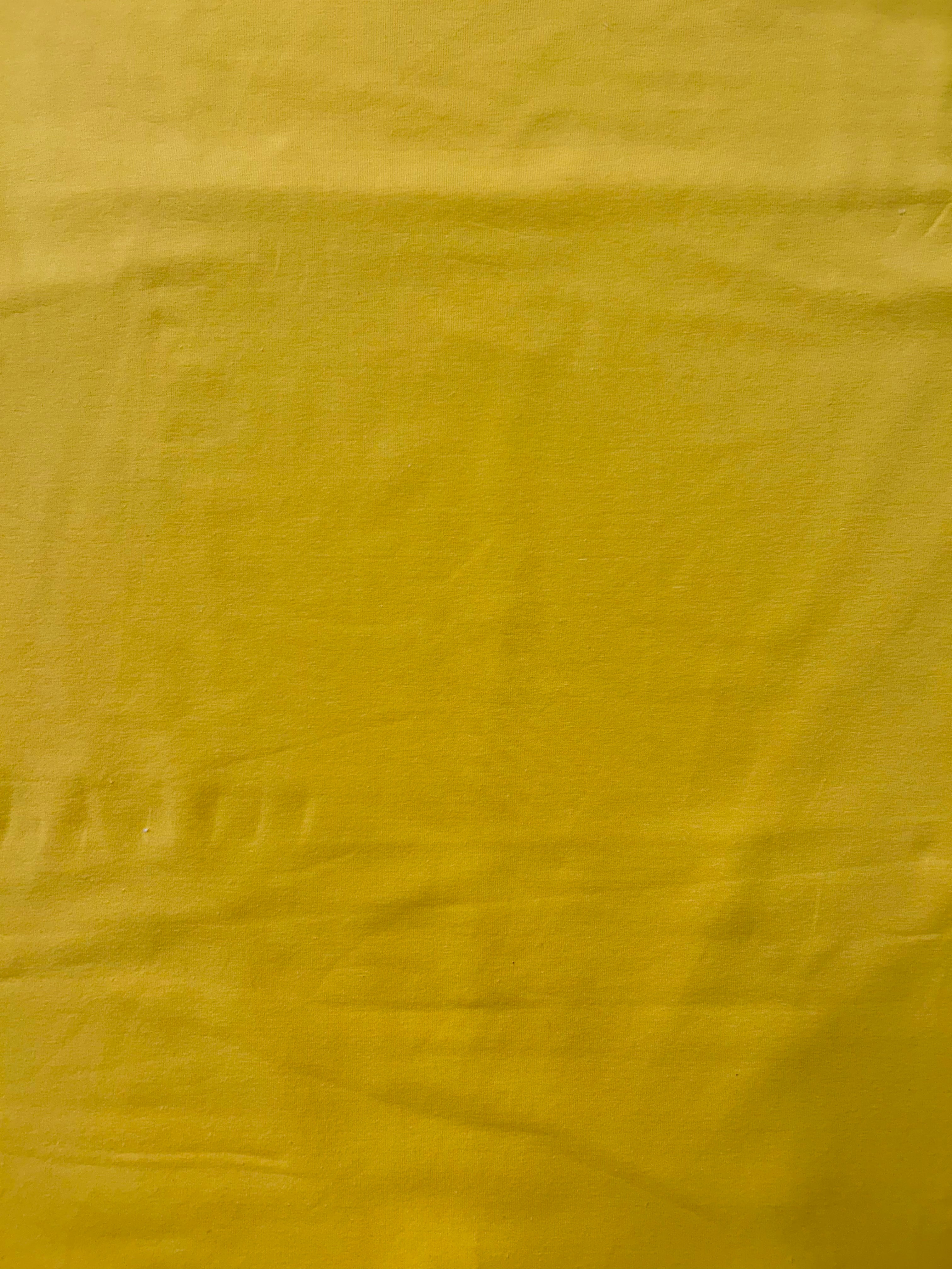 Bright yellow cotton lycra fabric.
