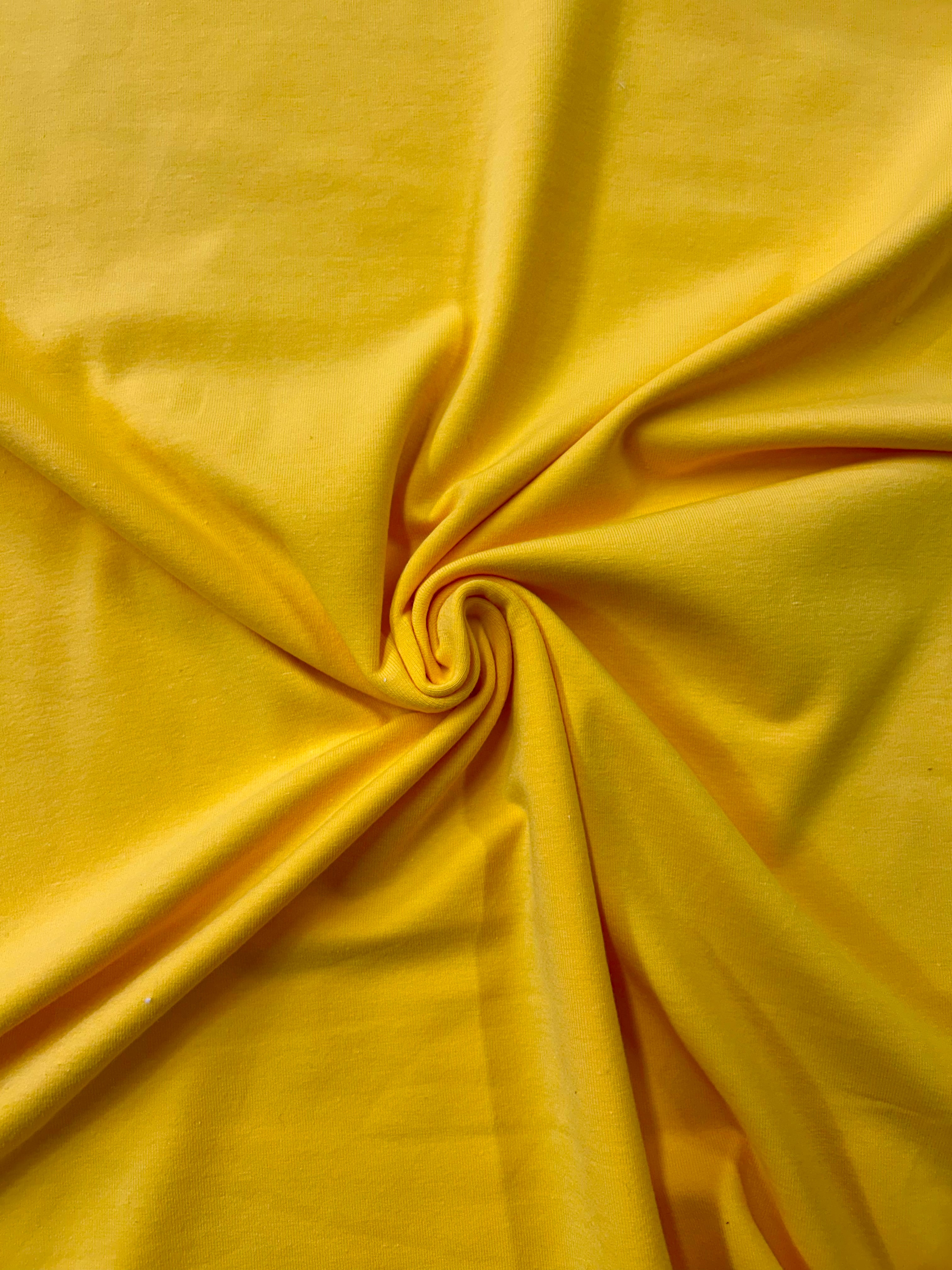 Bright yellow cotton lycra fabric in a swirl.