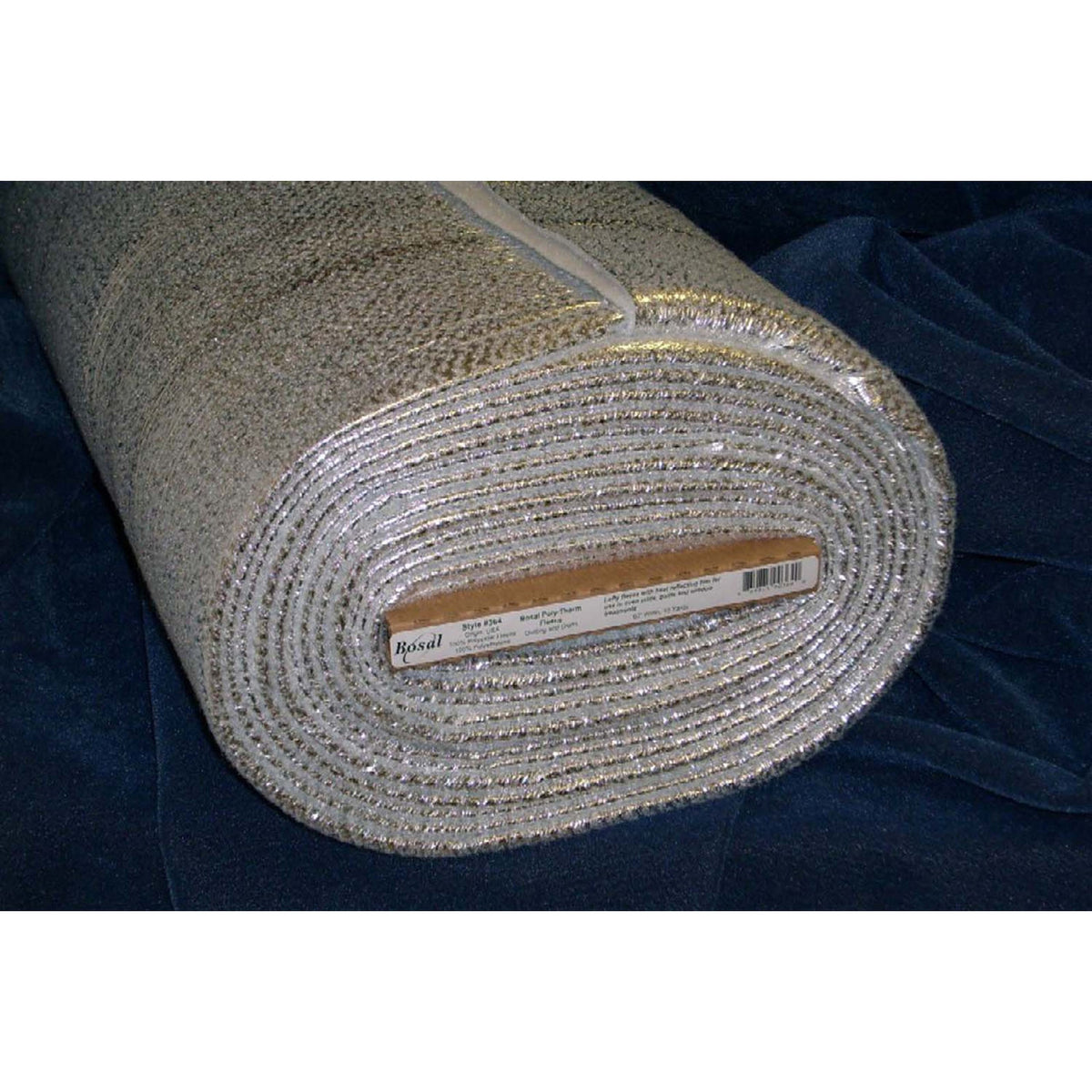 roll of silver looking polytherm fleece on a blue fabric
