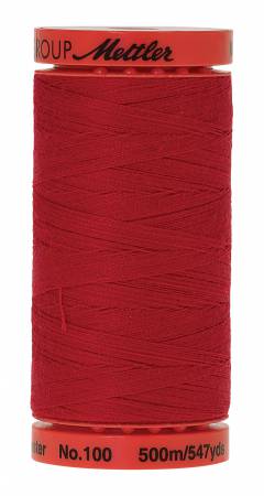 A spool of Mettler No. 100 sewing thread in a vibrant red color, shown against a plain white background.
