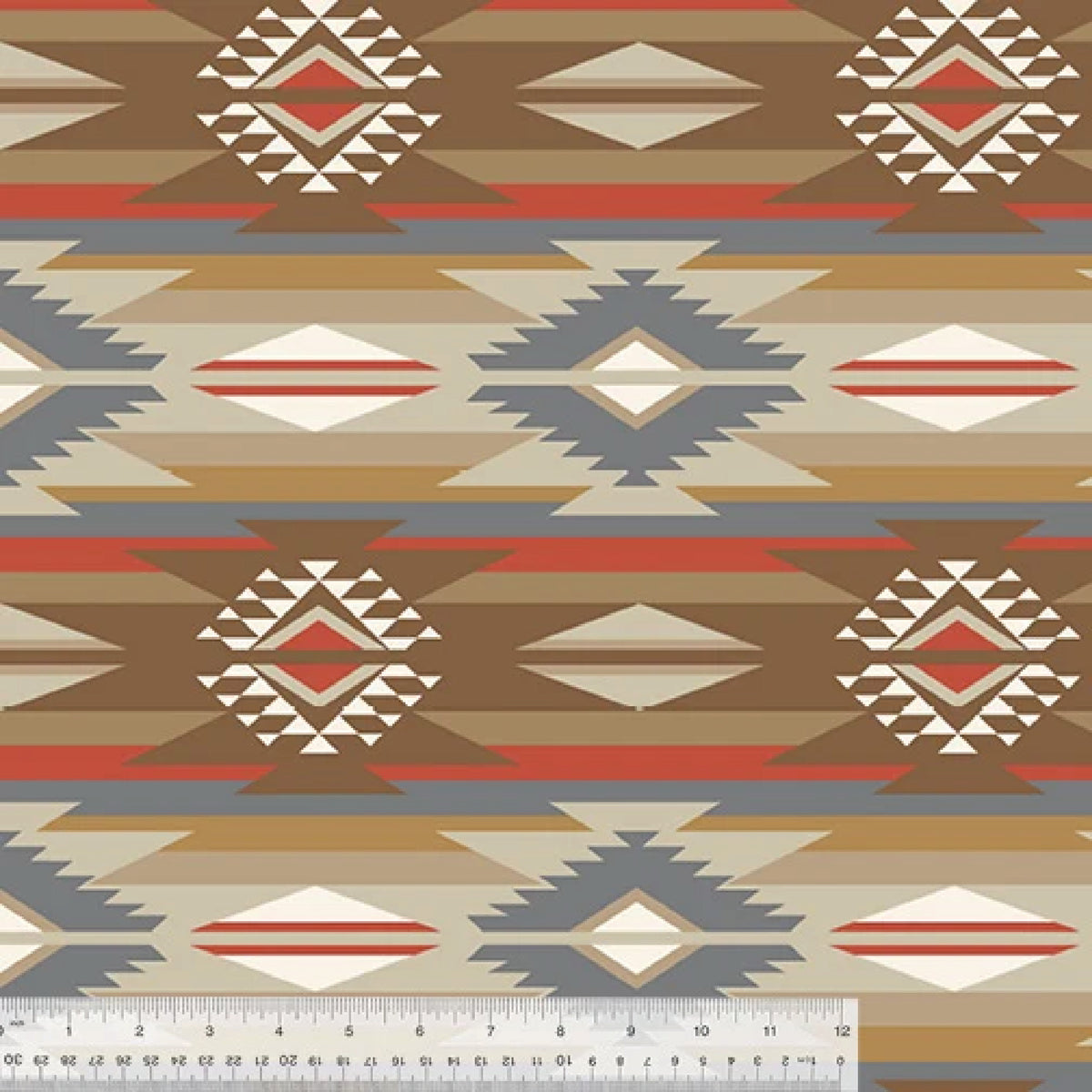 Fleece in a neutral Southwestern print in colors of brown, beige, white, red and grey. With a white rule at the bottom for scale.