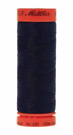 Spool of dark blue thread with red label on a white background