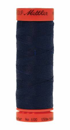 A spool of dark navy Mettler sewing thread wound on a bright orange spool, isolated on a white background.