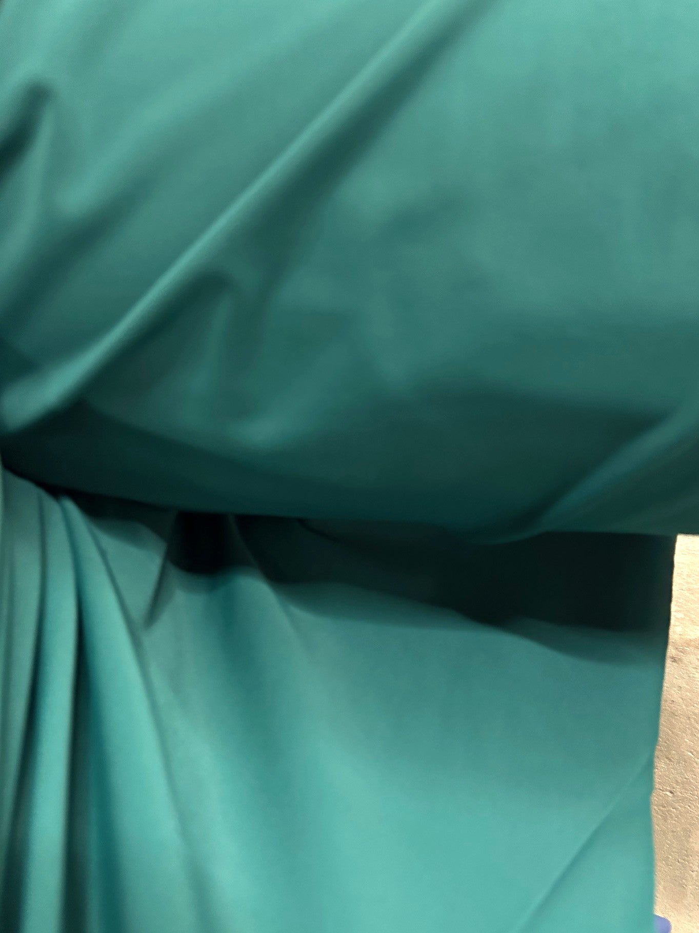 Close-up of green fabric with folds