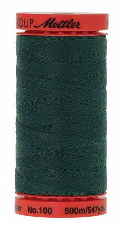 A spool of dark forest green sewing thread with red plastic end caps. The top cap features the black script logo 'Mettler', and the bottom cap displays 'No.