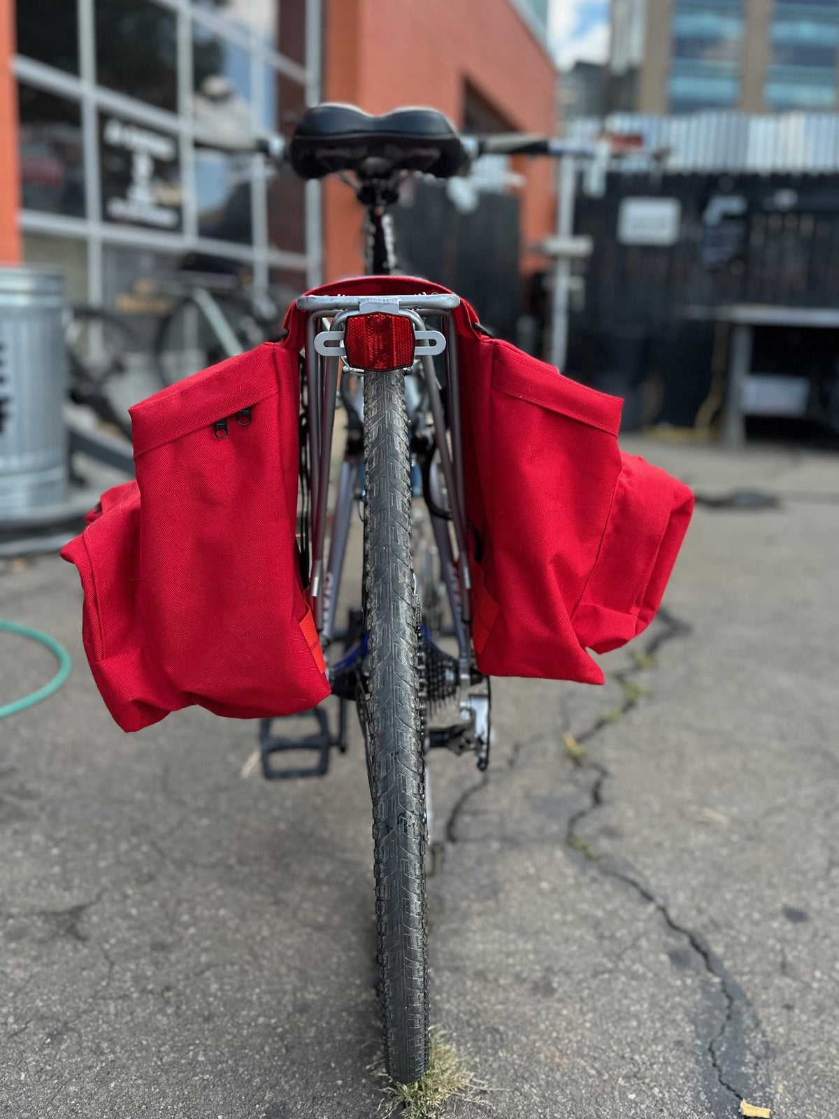 red saddle bag on the back of a bicycle