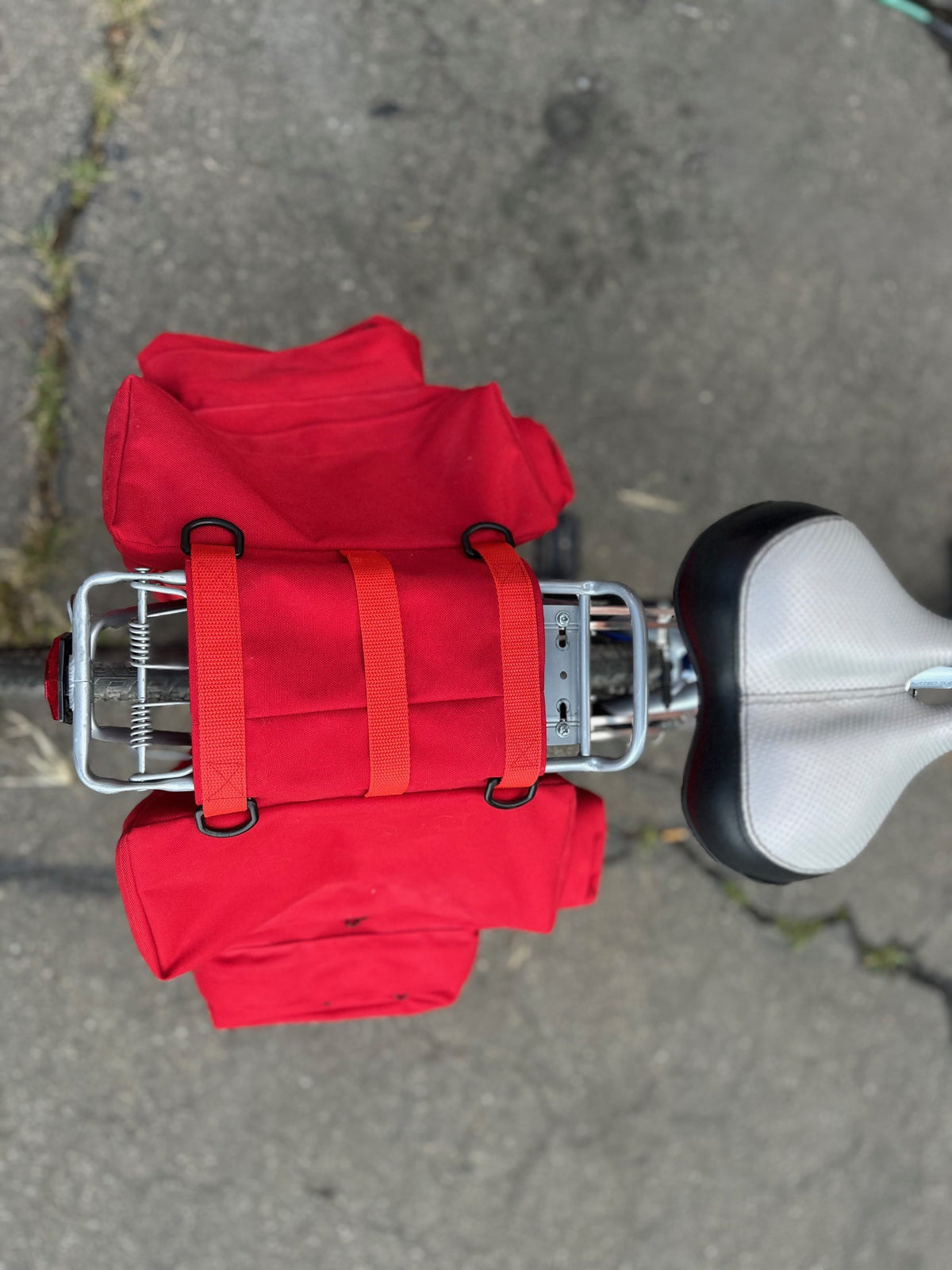 red saddle bag on the back of a bicycle - from the top