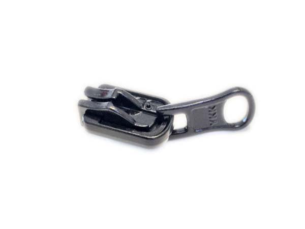 Metallic zipper pull on a white background