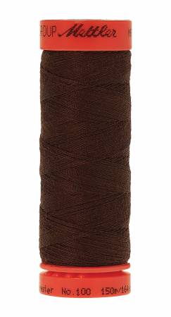 A spool of Mettler sewing thread in a dark brown color, featuring a bright orange-red plastic top and bottom cap with black branding text, isolated on a white background.