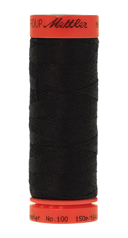 A spool of black sewing thread with a bright orange-red top and bottom cap, isolated on a white background.