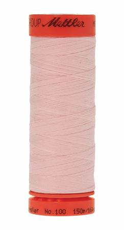 A spool of light pink sewing thread with orange-red end caps, branded 'Mettler'.