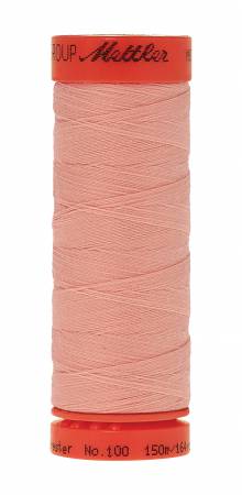 A spool of Mettler sewing thread in a dusty pink color, with a bright orange-red top and bottom cone, on a plain white background.