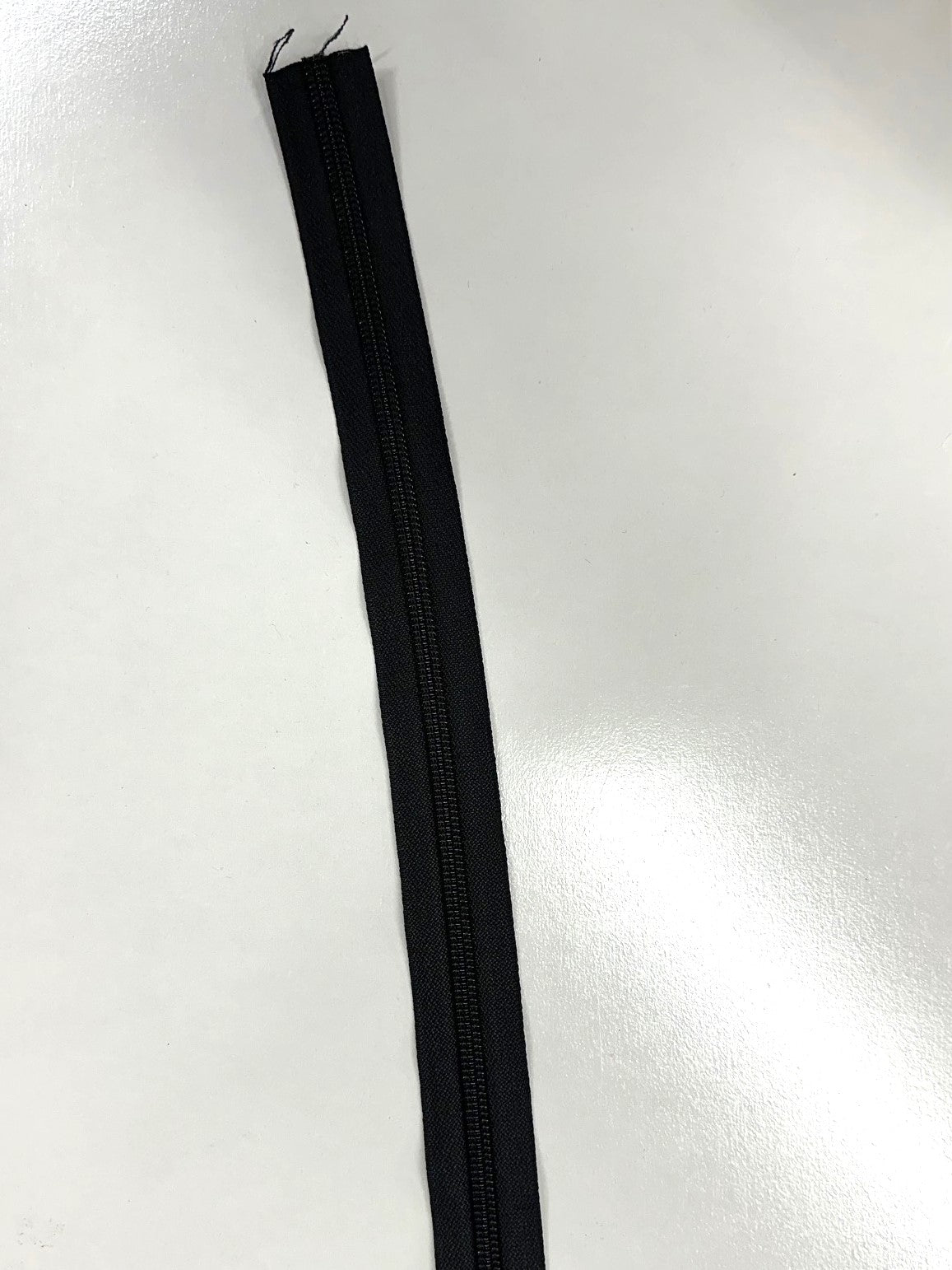 Coil zipper tape in black