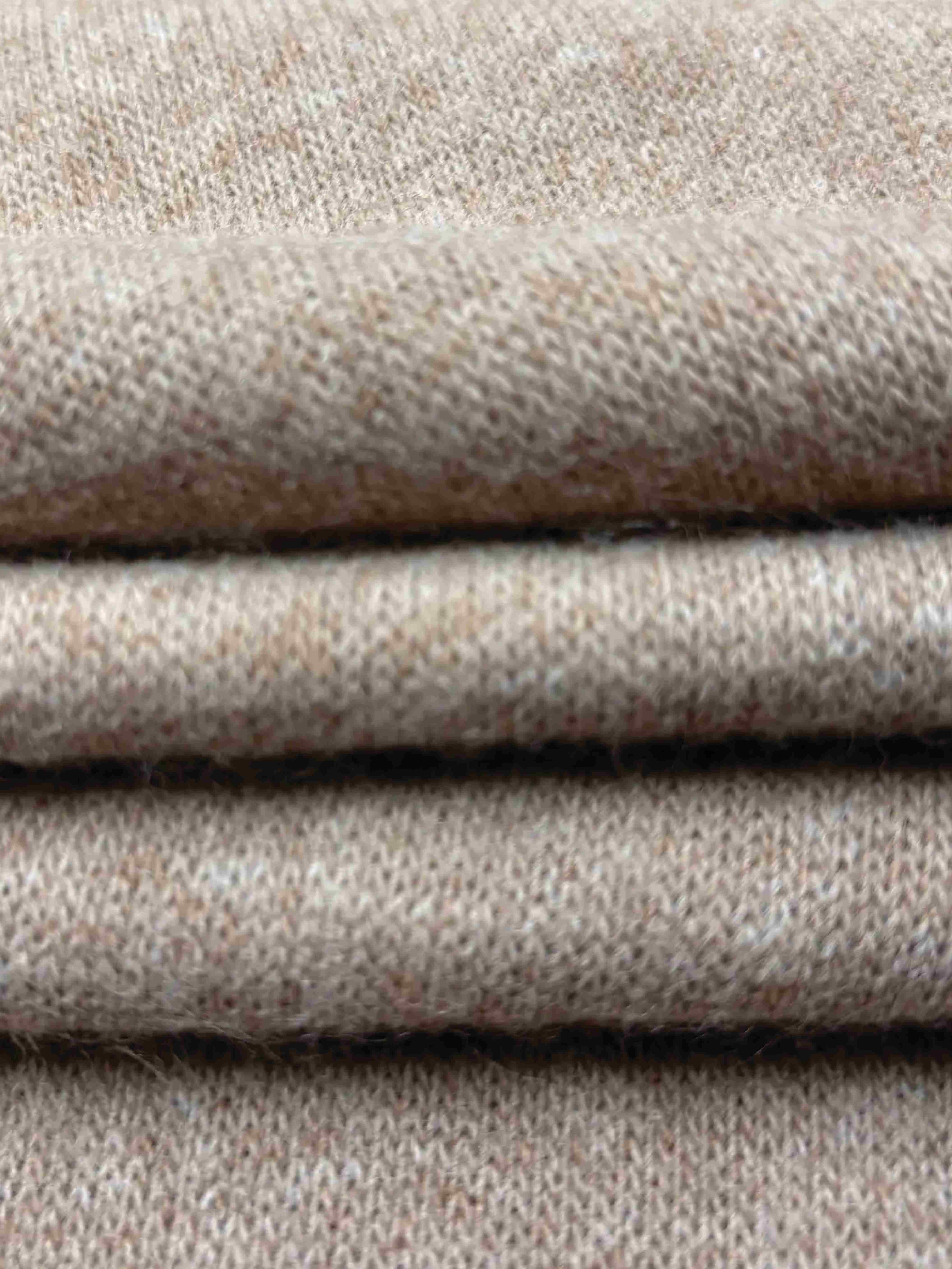 close up of beige knit fabric folded