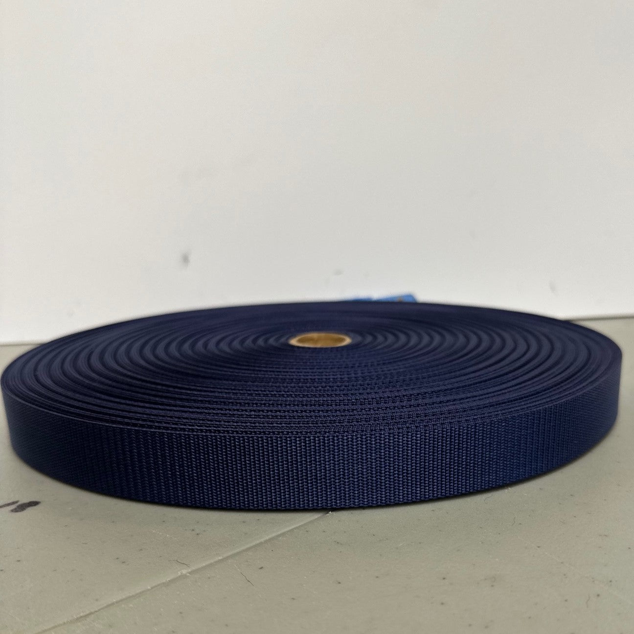 a roll of navy nylon webbing