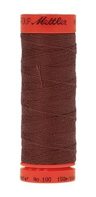 A spool of sewing thread in a dark reddish-brown color, wound around a bright orange spool with 'Mettler' printed on the top and bottom.