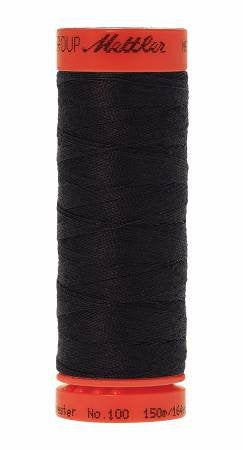 A spool of Mettler sewing thread, wound tightly around a spool with a bright orange-red top and bottom band. The thread itself is a very dark black or deep charcoal color.