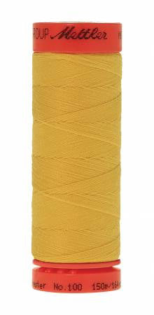 A spool of Mettler sewing thread in a bright mustard yellow color, with red plastic end caps, isolated on a white background.