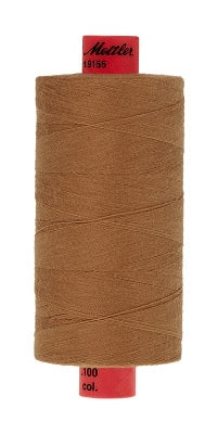 A 1000m spool of Mettler thread in a warm brown color, with red end caps showing the brand name Mettler.