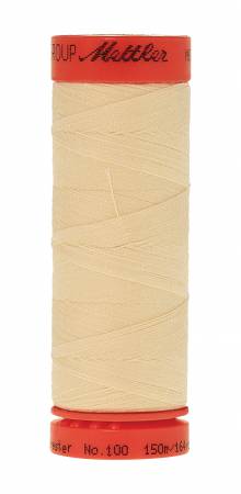 A spool of Mettler sewing thread, featuring a light beige thread wound around a spool with red plastic end caps. The brand name 'Mettler' is printed in black on the top red cap.